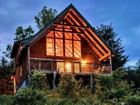 Bright lights shining from a Smoky Mountain cabin rental.
